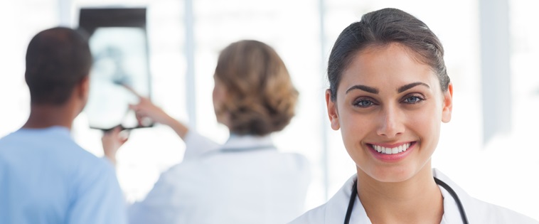 20s, Young Adult, Woman, Female, Caucasian, Man, Male, Mixed-Race, 40s, Mature Adult, Indoors, Looking At Camera, Nurse, Tunic, Practitioner, Profession, Professional, Specialist, Scrubs, Stethoscope, Standing, Clinic, Healthcare, Medical, Staff, Smiling, Happy, Cheerful, Portrait, Team, Talking, Holding, X-ray, Pointing, Hospital